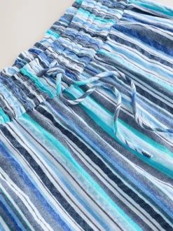 - Broek met wijde pijpen en elastische taille*Next