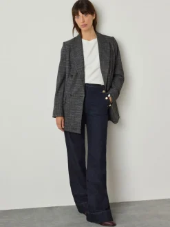 - Jeans met wijde pijpen en gouden knopen aan de voorkant*Next Best