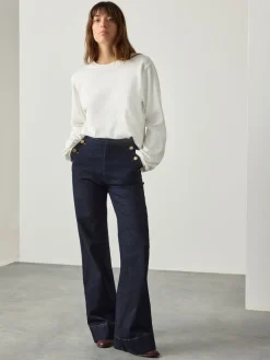 - Jeans met wijde pijpen en gouden knopen aan de voorkant*Next Best