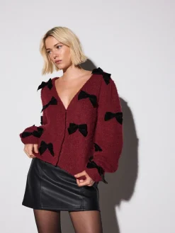 - Gebreid vest met fluwelen strik*Next