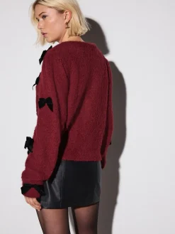 - Gebreid vest met fluwelen strik*Next