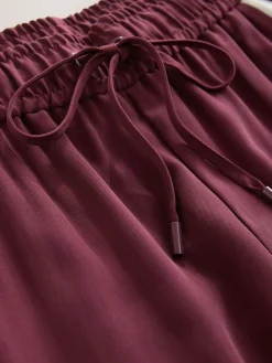 - Wijduitlopende broek met streep langs de zijkanten*Next Clearance