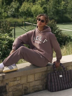 Bruin - joggingbroek met boorden*self. Clearance