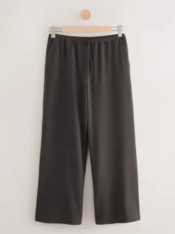 - Broek met koordje aan voorkant en wijde pijpen*Next Discount