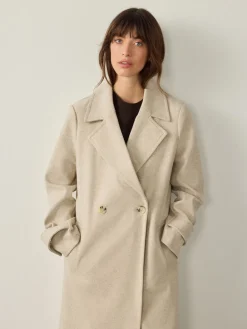 - Lange maxi-jas*Next Best