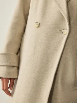 - Lange maxi-jas*Next Best