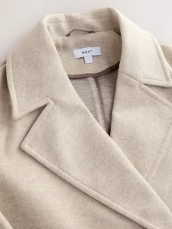 - Lange maxi-jas*Next Best