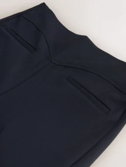 - Corrigerende broek met grote zakken*Next