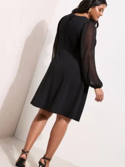 - Doorzichtige mini-jurk met hardwaredetail en lange mouwen*Friends Like These Sale