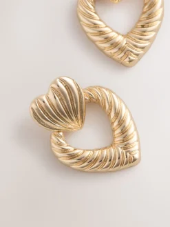 Goudkleurig - Opvallende hartjesoorbellen*Next