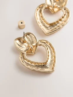 Goudkleurig - Opvallende hartjesoorbellen*Next