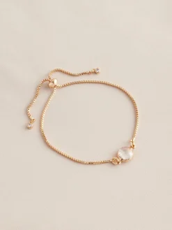 Goudkleurig - Trekarmband met geboortesteen*Next Online