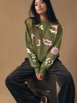 - Sweatshirt with Appliqué Details*Next