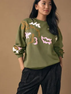 - Sweatshirt with Appliqué Details*Next