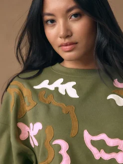 - Sweatshirt with Appliqué Details*Next