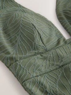 Kakigroen met bladertextuur - Diepuitgesneden vormgevend buikcorrigerend badpak*Next Online