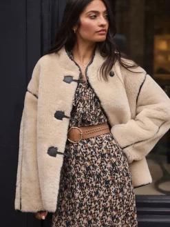 - Brede riem met vlechtdetail*Next Discount