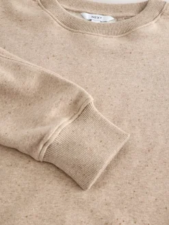 - Essentials sweatshirt met relaxte pasvorm, lange snit en zakken*Next Online