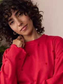 - Zachte pyjama met lange mouwen en hartjesprint*Next New