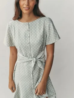 - Mini-jurk met strikceintuur*Next