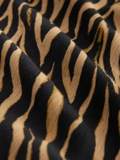 - Maxirok met getailleerde taille*Next Online