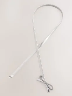 - Smalle stretchriem*Next