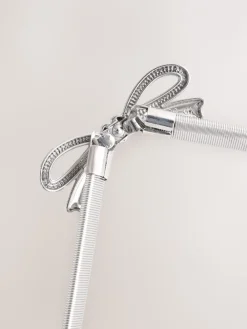 - Smalle stretchriem*Next