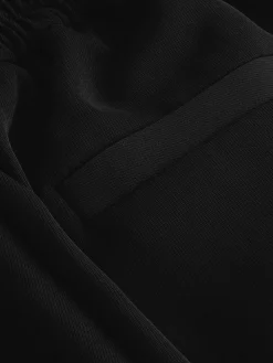 - Broek met wijde pijpen en elastiek in de achterkant*Next New