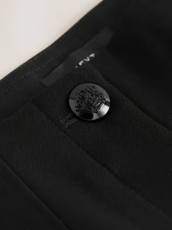 - Corrigerende broek met grote zakken*Next Online