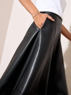 - Faux Leather Midi Skirt*Friends Like These Best