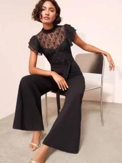 - jumpsuit van kant en scubamix met ruches aan de mouwen*Friends Like These Clearance