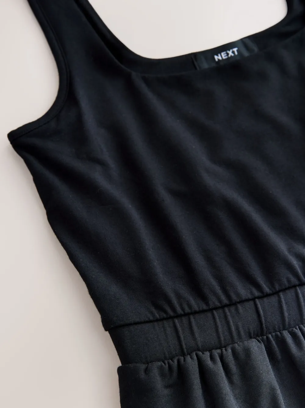 - Jersey jumpsuit*Next Sale