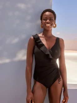 Zwart - Ondersteunend badpak met buikcorrigerend effect en ruches*Next