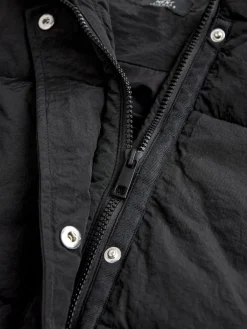 Zwart - Regenbestendige bodywarmer met capuchon en gebreide kraag*Next