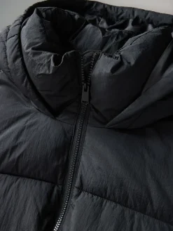 - Lange gewatteerde midi-jas met capuchon*The Set Hot