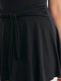 Zwart - Vormgevend, buikcorrigerend zwemjurk met rokje*Next Sale