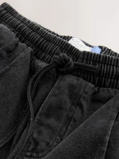 - Denim joggingbroek met plooitjes en wijde pijpen*Next Hot